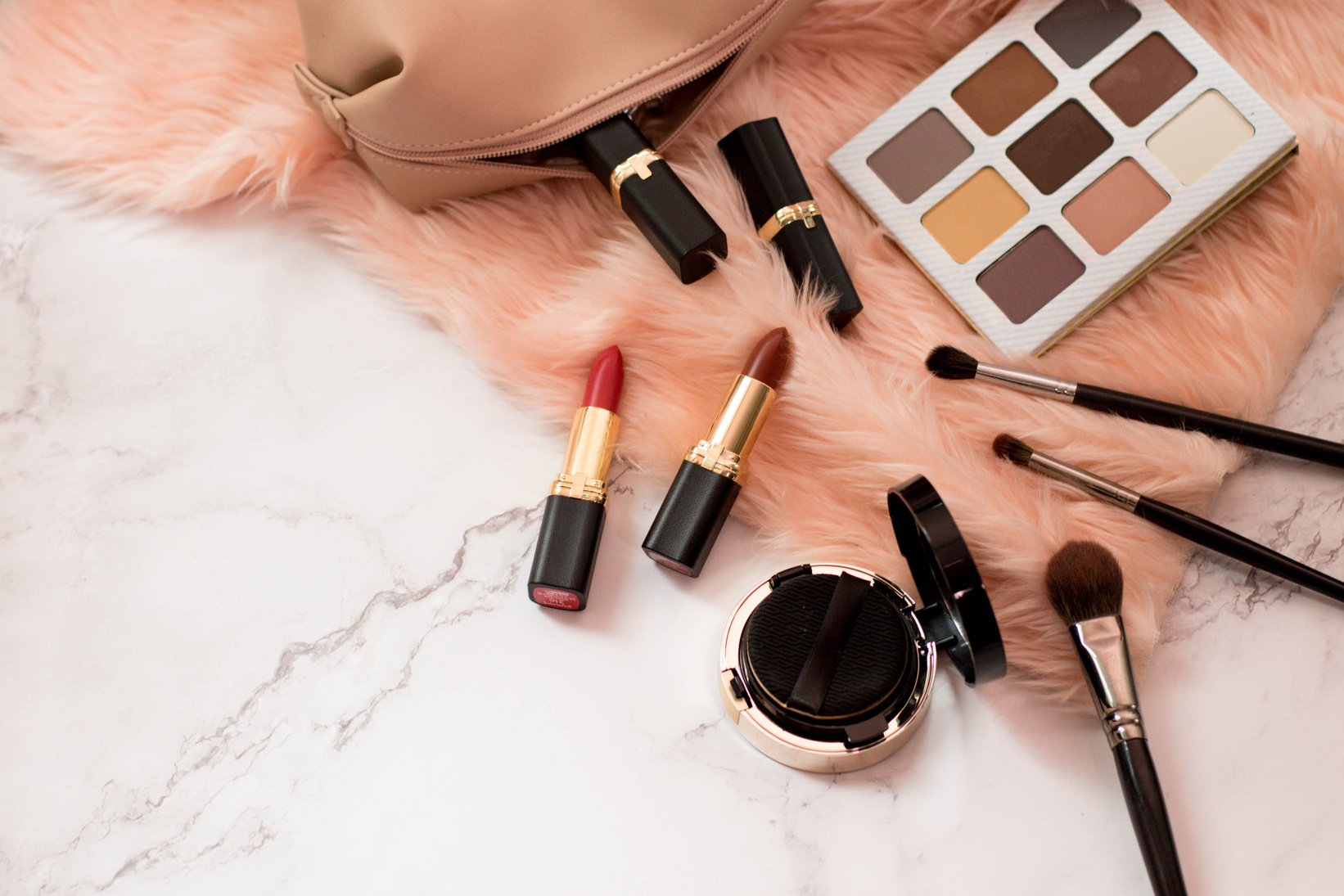 Makeup Kit with Beauty Products on Fur Carpet Flatlay